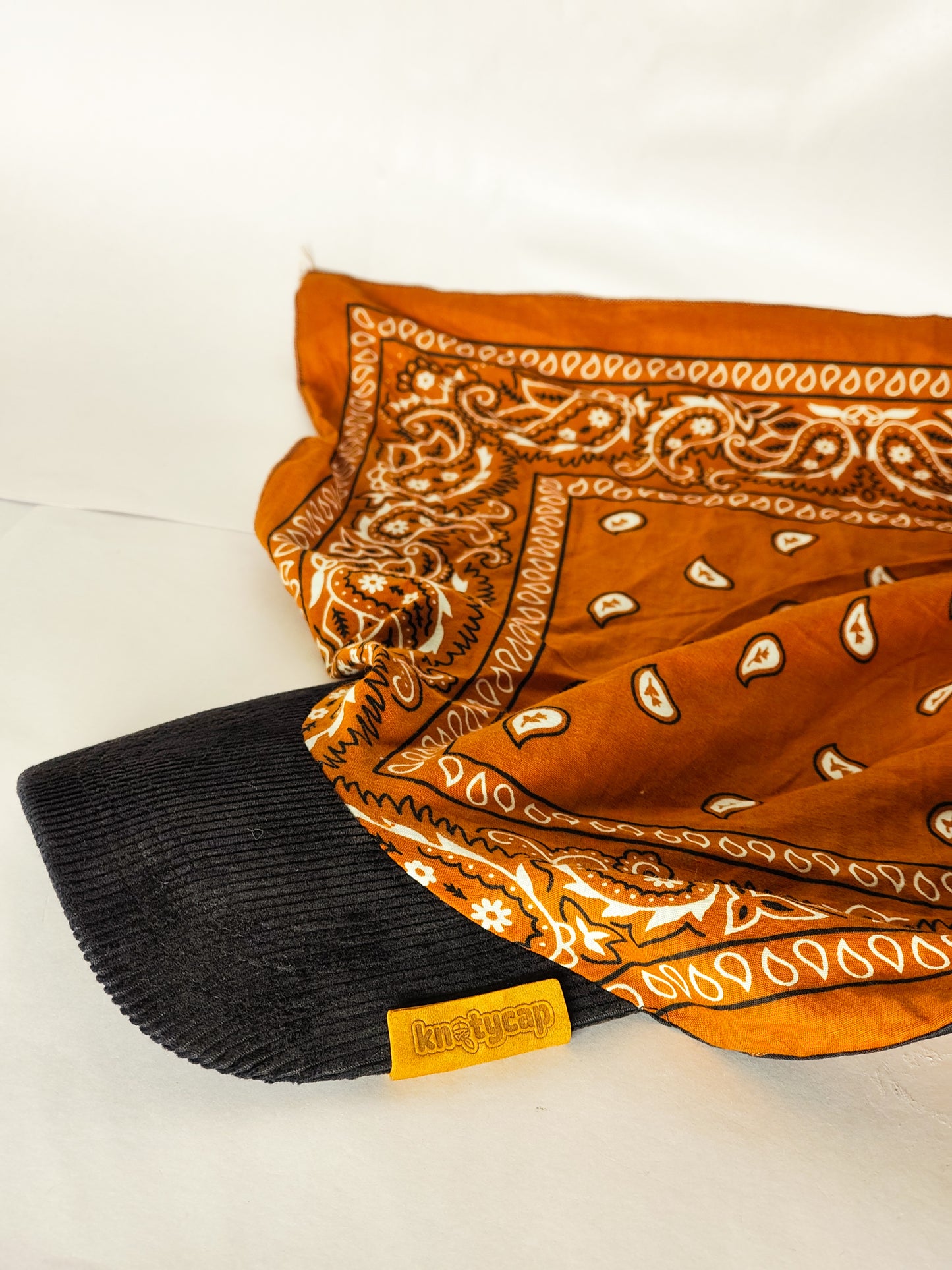 Kapri™ – Black Corduroy Brim × Orange Printed Bandana (OG Drop)
