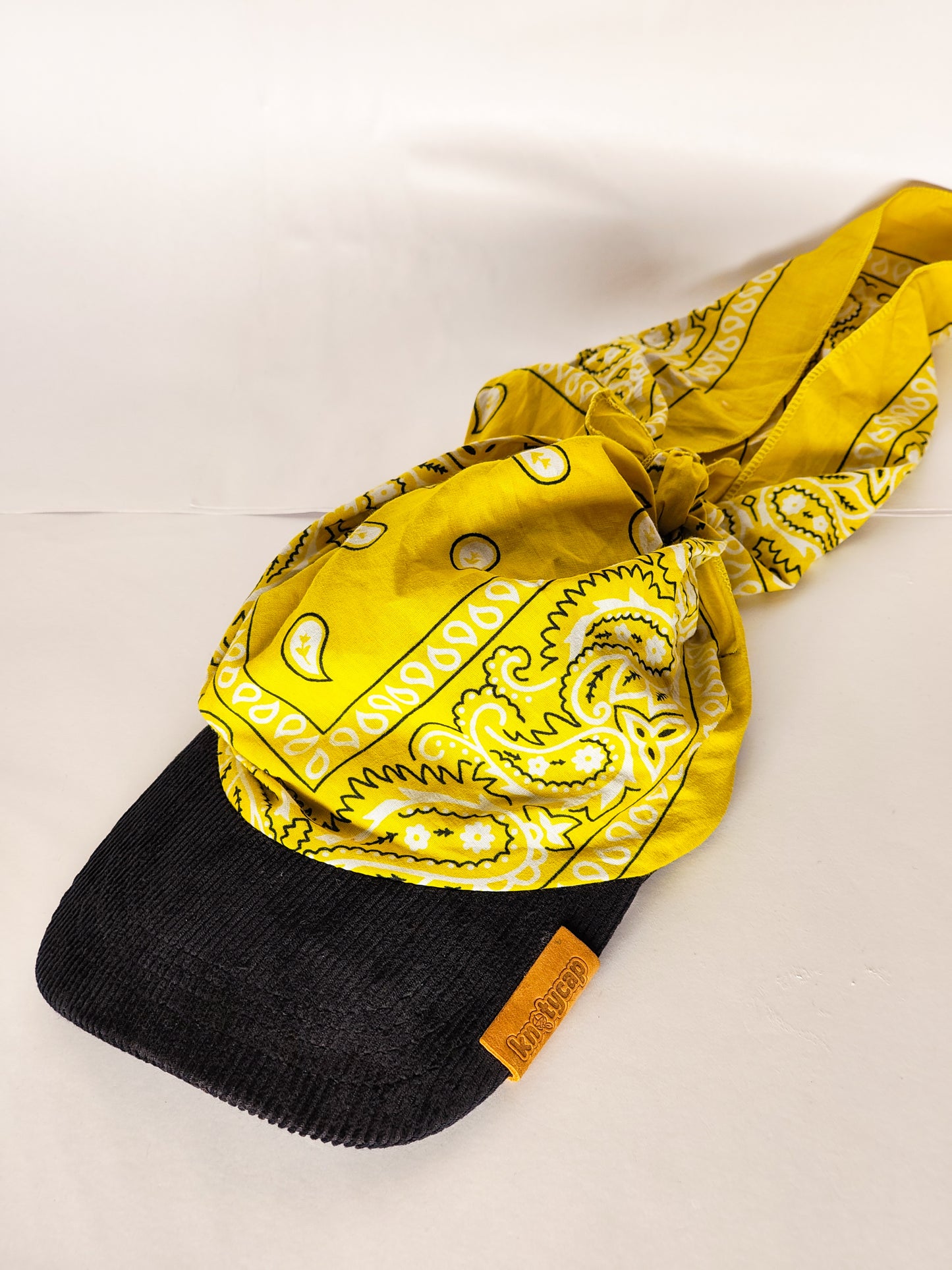 Kapri™ – Black Corduroy Brim × Yellow Printed Bandana (OG Drop)